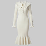 White ribbed dress with ruffled collar on a white background